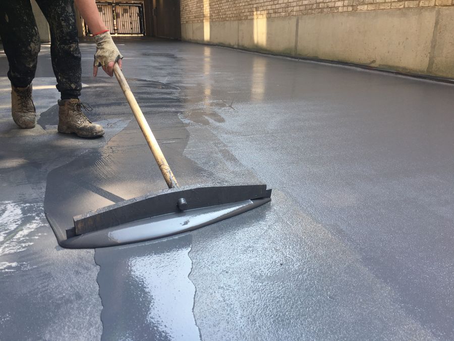 Application of high build epoxy floor coating to a floor